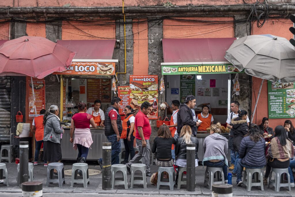 Lively street scene with taco vendors and crowds, centro historico, Mexico City, Mexico.