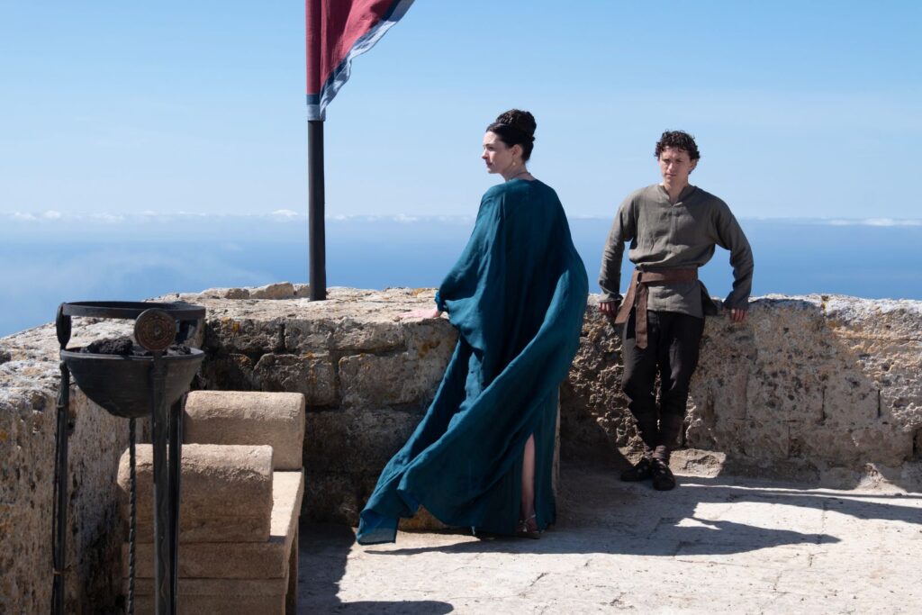 Penelope (Anne Hathaway) and Telemachus (Tom Holland) of The Odyssey.